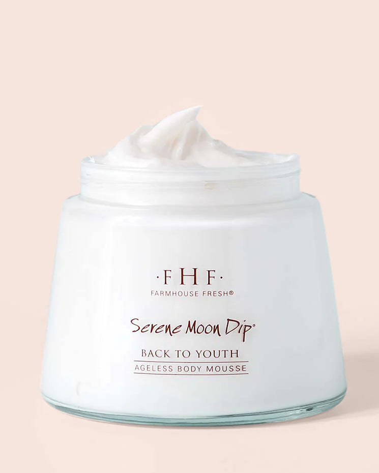 Jar of Farmhouse Fresh 'Serene Moon Dip' body mousse on a beige background
