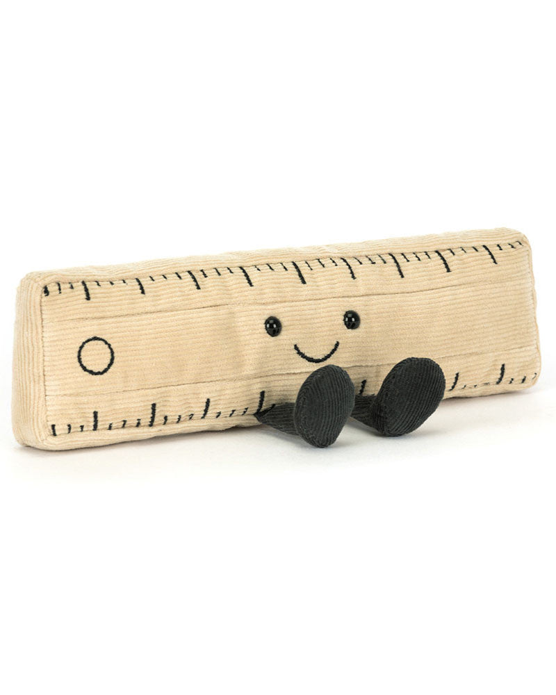 Toy ruler with a smiling face on a white background