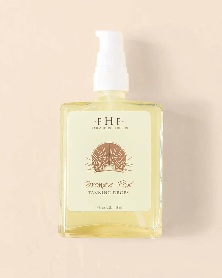 Bottle of FHF Bronze Fox Tanning Drops on a beige background