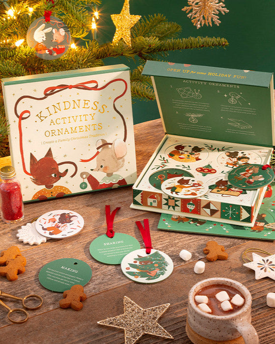 Kindness Activity Ornaments set with Christmas tree and hot chocolate in the background