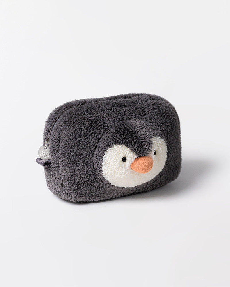 Fluffy penguin-shaped pouch on a light gray background