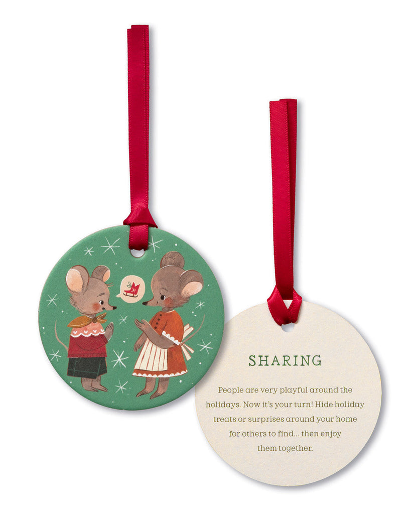 Two round Christmas ornaments with illustrations of mice and text on a white background