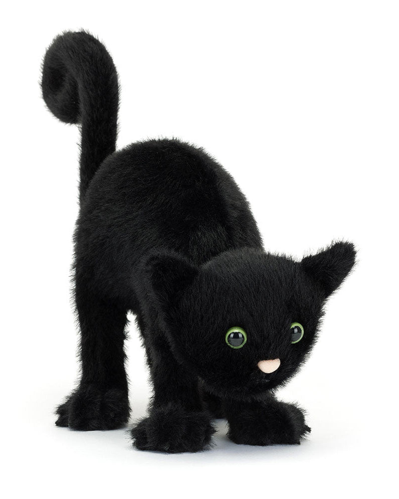 Plush black cat toy on a white background