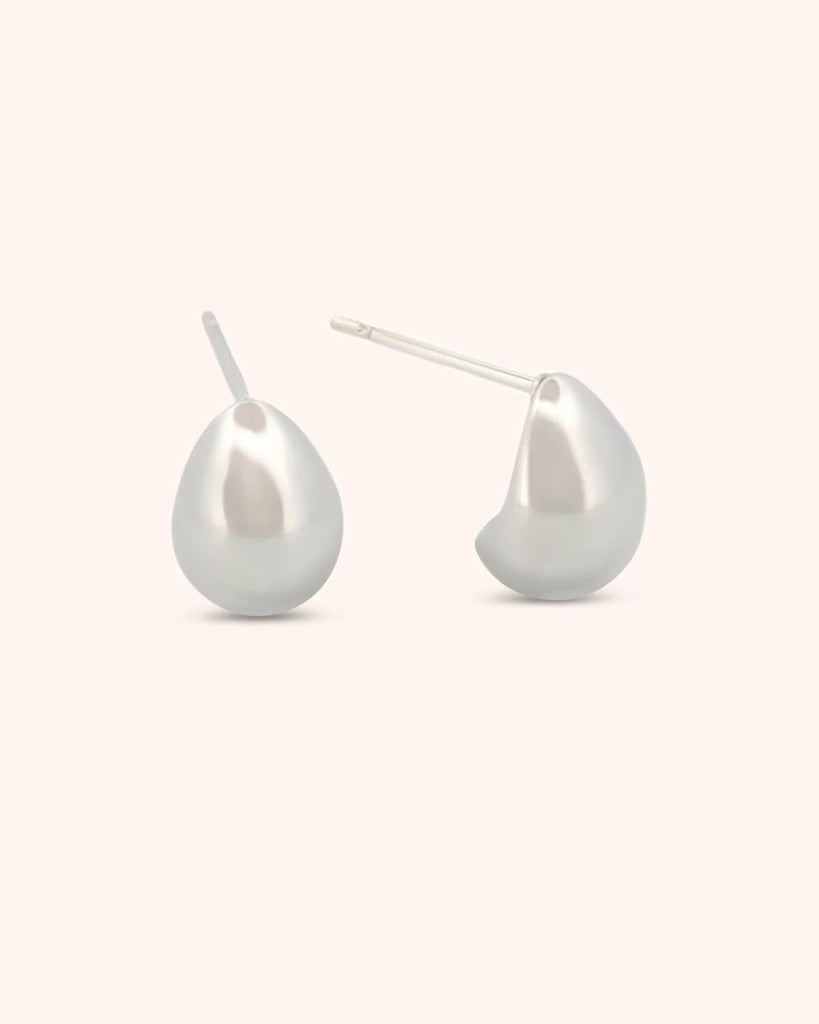 Pair of pearl earrings on a white background